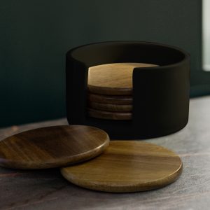The Keepsake Coaster set is a premium coaster set - 6 circular acacia wood coasters. Black ceramic Storage holder. Ready for you to personalise for your clients.