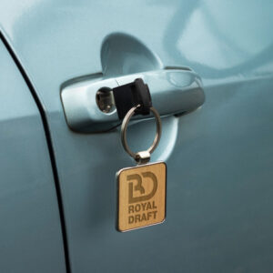 The Santo Key Ring is a square shiny nickel or gunmetal key ring with beech or sapele wood. Durable key chain. Individual black box. Engraving or print ideal.